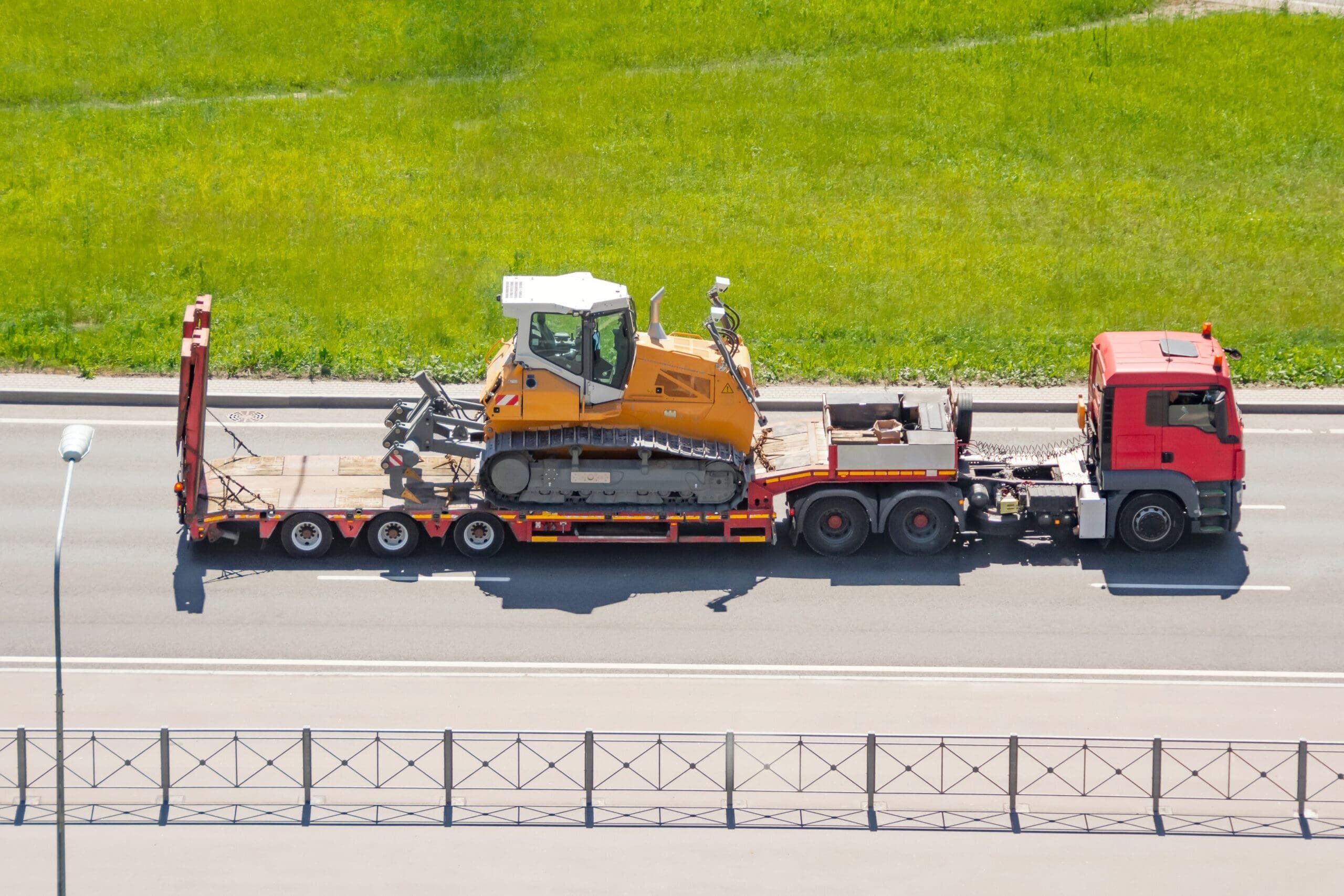 Trailer truck with long platform transport the excavator