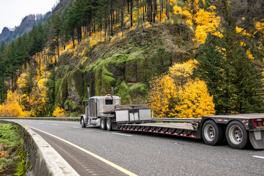 step deck trailer on road