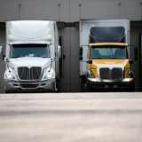 what is full truckload freight - semi trucks being loaded up